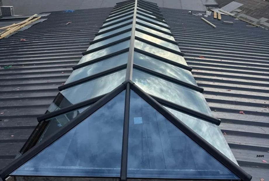 Full-length ridge lantern running the length of a large commercial roof